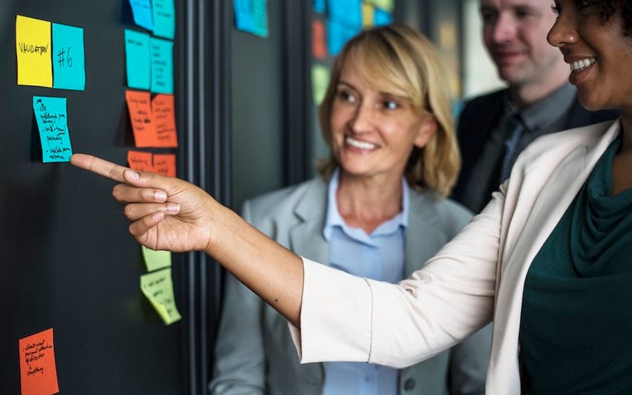 A woman explaining something to her colleagues