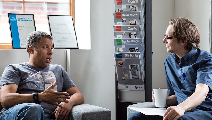 One man talking, another man listening