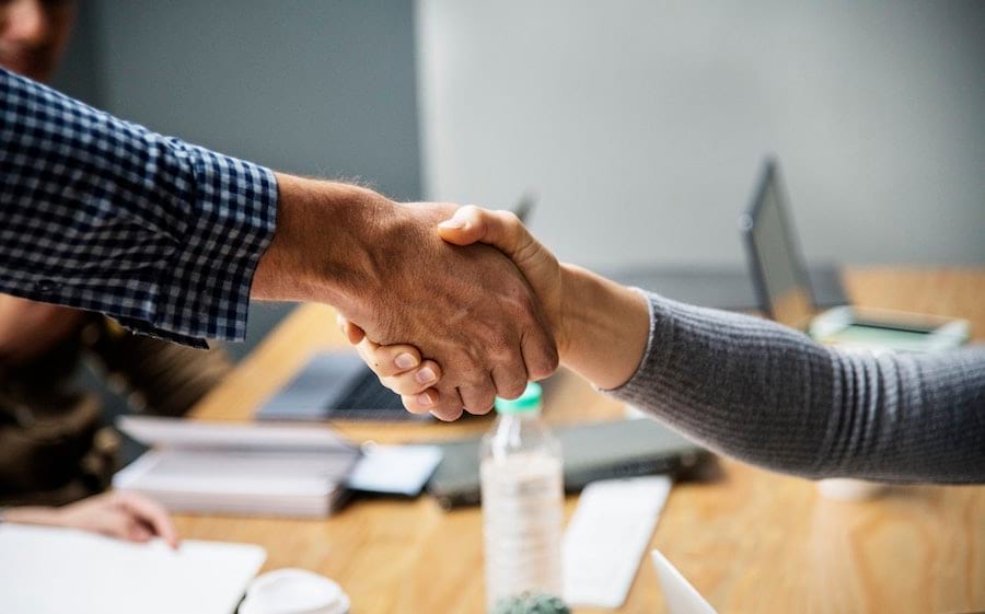 Two persons shaking hands